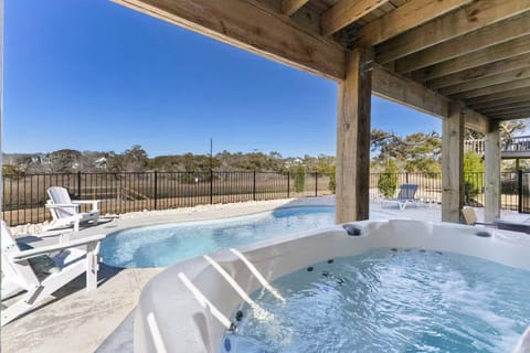 A view from the hot tub overlooking the pool and waterway. 