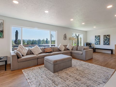 Spacious living room with Mt. Hood view through large picture windows

