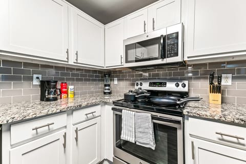 You can almost hear the sizzle of ingredients as you cook in the well-equipped kitchen, where every detail is designed for convenience.