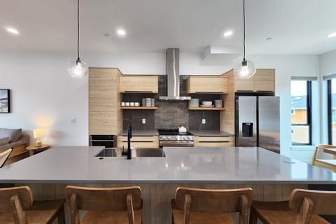 Sit at the counter and keep the cook company.