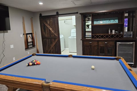 Game Room with Pool Table, and Fridge, and Games.