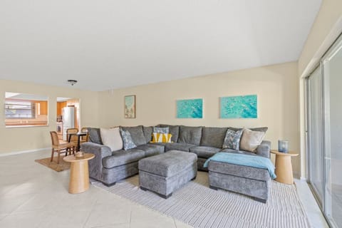 Step into comfort! 🛋️ This bright and inviting living room in one of our units offers ample space to relax. Look at that beautiful natural light! ☀️