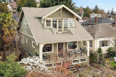 Beautiful home perched on edge of East Queen Anne with incredible sunset/ mountain/ bay views.