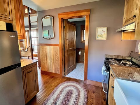 The kitchen opens to the bathroom and bedroom / living space.
