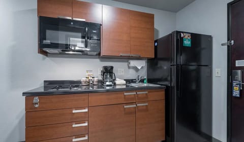 Cook and snack easily with fridge, microwave, and stovetop.