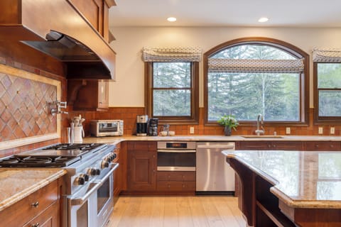 Kitchen features stainless steel appliances.
