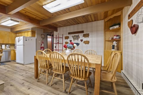 Gather around the hearty farmhouse table at The Laughing Pig—seating for ten and made for unforgettable meals and laughter-filled nights.