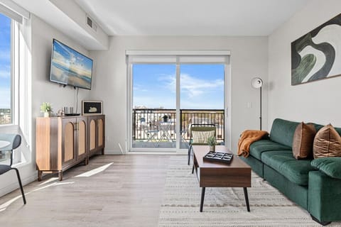 The living room is filled with natural light, creating a bright and welcoming space that invites relaxation.