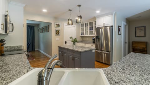 Fully appointed kitchen adjacent to the home`s dining room and laundry room.