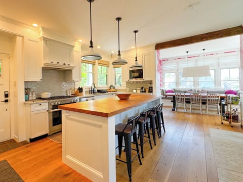 Kitchen view with dining room in the background.