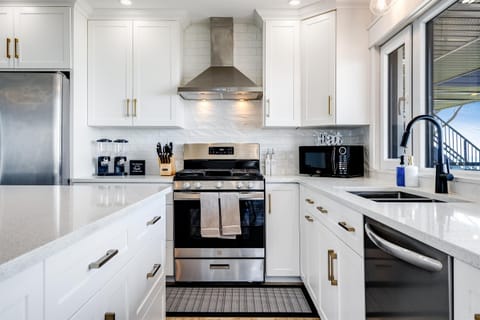 Matte black fixtures and stainless steel appliances