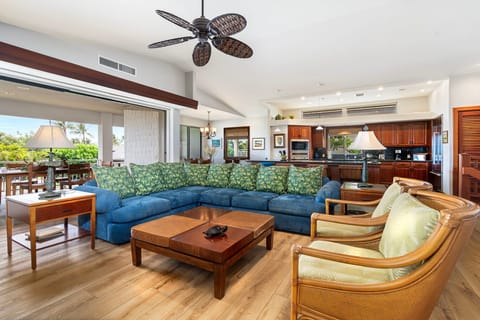 Open Living Space flows seamlessly from Kitchen to Living Room and outdoor Lanai