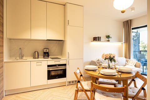 Fully equipped kitchenette with dining area – cook and dine just like at home.