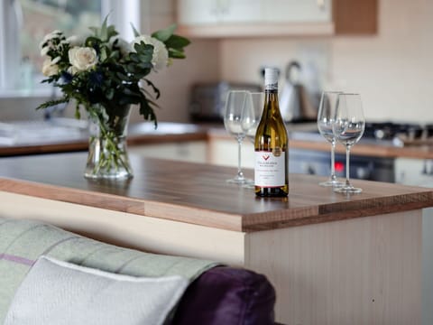 Furniture, Tableware, Table, Interior Design, Drinkware, Wood Stain, Countertop, Bottle