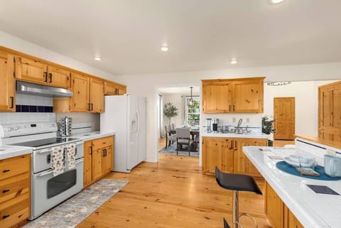 Spacious kitchen leading to indoor formal dining room and connect with living room