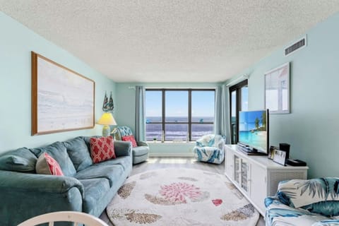 The oceanfront living room is well-appointed with comfortable furnishings.