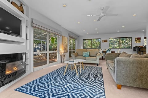 Set up for both summer and winter with a ceiling fan and gas fireplace.