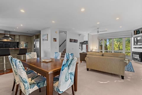 The open-plan area includes the kitchen, dining table and living room.