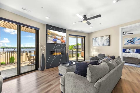 Bright living area with electric fireplace, Smart TV, and ample seating 