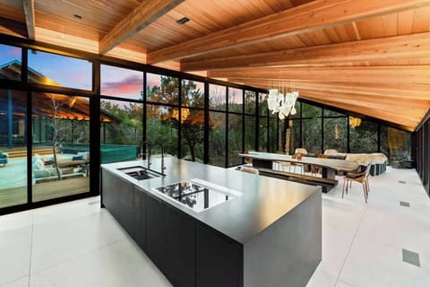 Indulge in the art of culinary creation on the expansive kitchen island, a haven for passionate cooking.