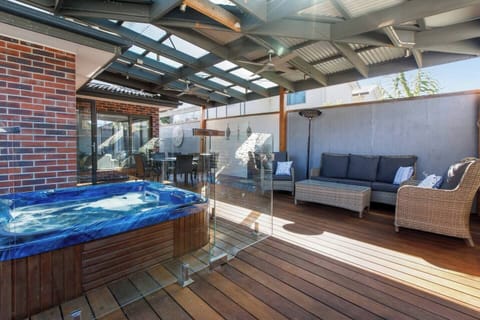 Relax in the bubbling hot tub, set privately on the deck for ultimate evening relaxation.