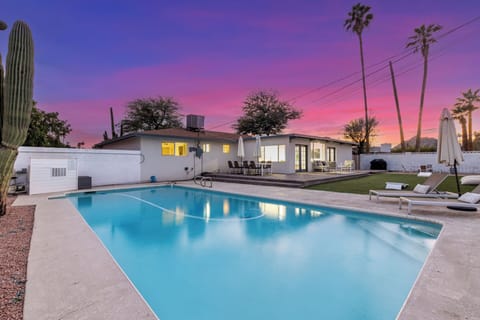 Enjoy stunning sunsets over the desert and palm trees from your backyard oasis