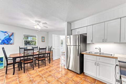 Holmes Hideaway, gather around the dining table with friends and family, where every meal feels like a special occasion.