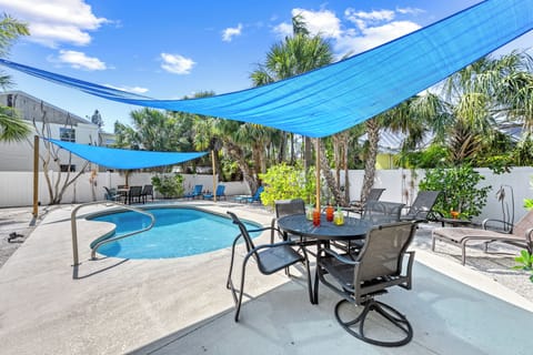 Gather for grilled favorites and laughter under the sail shade, with palm trees swaying and the scent of salt in the air.