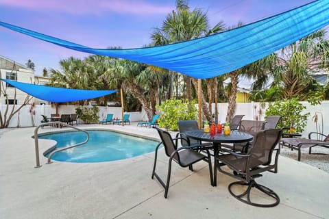 Float beneath swaying palms, sip something cold, and let the sun melt the last of your worries—this is poolside bliss, island-style.