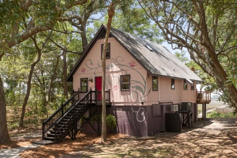 The beautiful cottage style home with painted details on the exterior of the home.