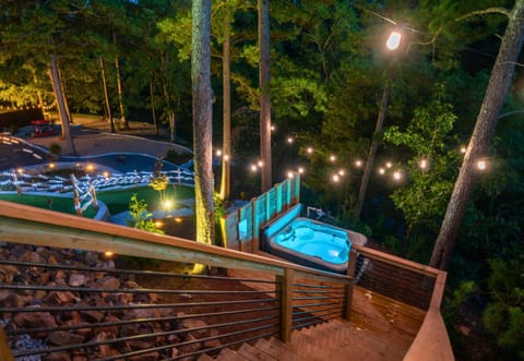 Twilight soak sessions under twinkle lights — your private hot tub retreat in the woods.