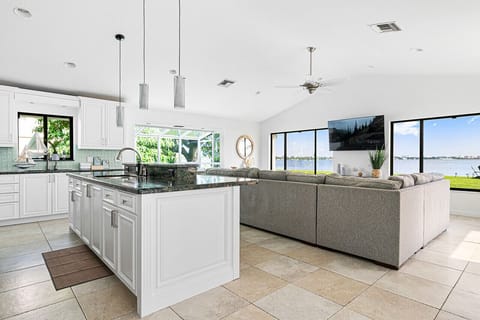 Spacious living and dining area with panoramic views, creating a bright and airy atmosphere for gatherings.

