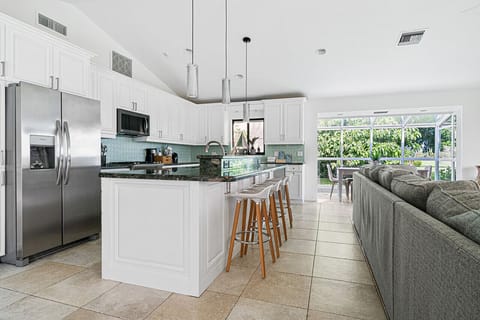 Open-concept kitchen and living area, offering a seamless flow for easy interaction and enjoyment.