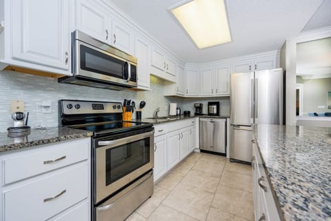 Cook and gather in this spacious kitchen featuring stainless steel appliances and ample counter space for meal prep
