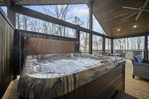 Hot Tub Retreat: Unwind in style with nature views and bubbling relaxation at your fingertips!