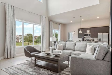 Experience luxury in this bright, modern 2-story condo! Featuring a spacious living area, gourmet kitchen, and stunning golf course views, this stylish retreat is perfect for relaxing. Close to top attractions, dining, and shopping. Book now!