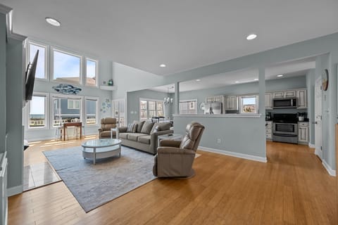 Spacious and airy home with a loft area and a cozy fireplace.