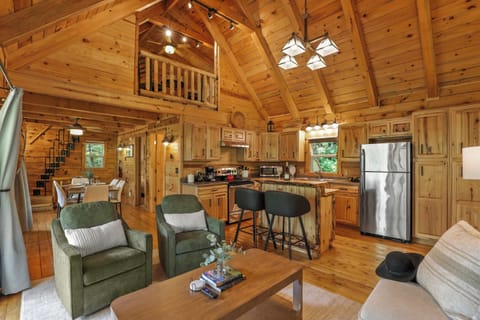 A-frame interior design of the big cabin with open concept living and walkout access to the deck.