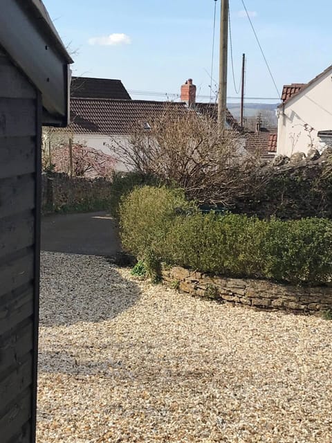 View from property back down private driveway and surrounding cottages