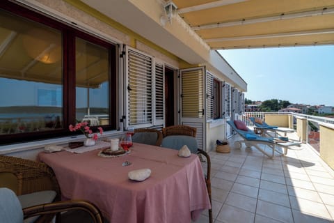 Balcony with sitting area and sun loungers