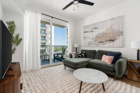 Snuggle in and enjoy the smart TV experience in this chic and comfortable modern living area.