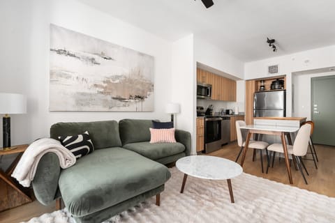 Settle in and relax in this cozy living area, thoughtfully furnished with a dining table and chairs.