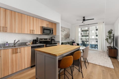 Settle in and relax in this cozy living area, thoughtfully furnished with a dining set.