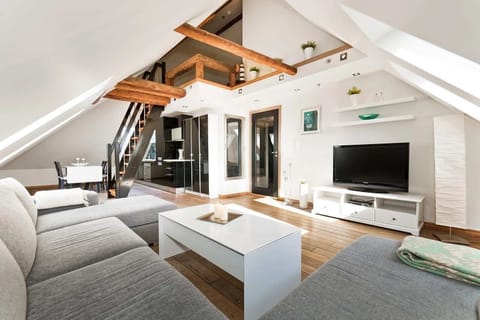 Warm wooden floors and high ceilings and filled with natural lights