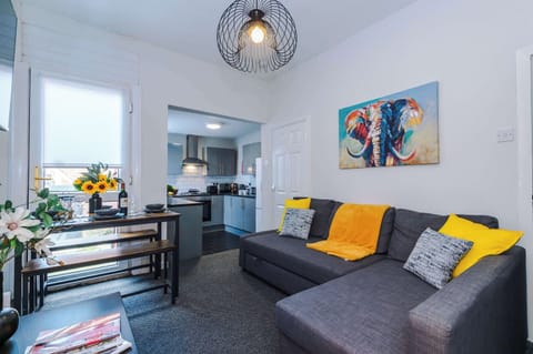 The colourful living room is open plan, allowing you to relax and dine seamlessly. It is equipped with a SMART TV, sofa bed and bench seating for you to enjoy a meal in the evening.