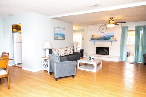 Overview of the great room with a 65 inch smart TV