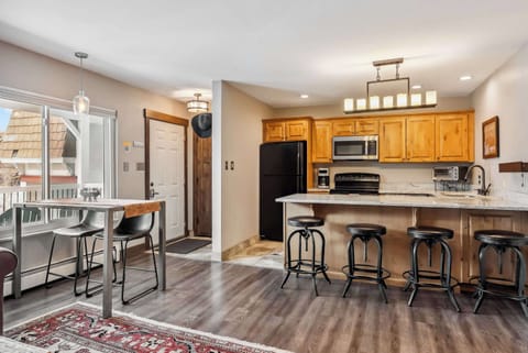 Kitchen: Drip coffee maker, Crockpot, blender, toaster, kettle, cooking utensils, tableware