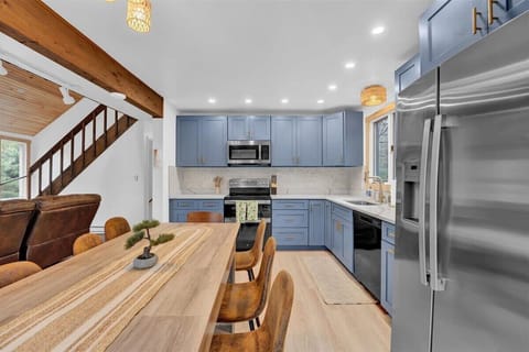 Open Kitchen with Island and Stainless Steel Appliances