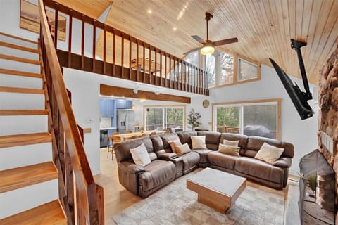 Spacious A-Frame Living Room with Loft and Cozy Seating
