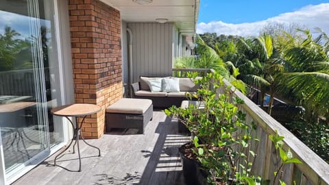 Covered balcony with Seaview's Relax in the sunshine with your morning coffee. Or enjoy Happy Hour with friends. 